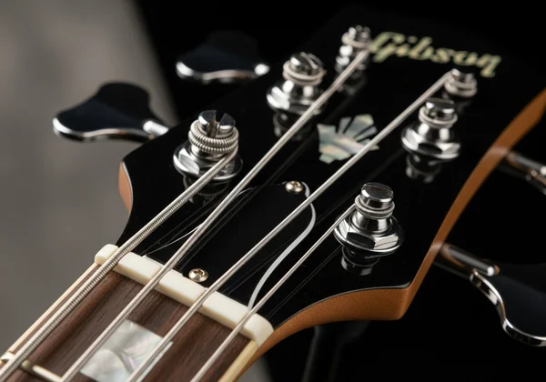 Bass guitar with new strings, perfectly in tune